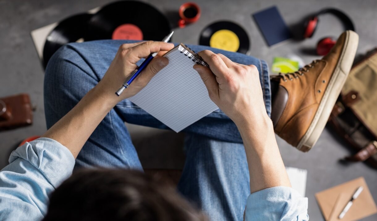 Unleashing Creativity: Simple Exercises to Spark Innovative Ideas 1 male hand holding pen or pencil and notebook stude 5S89XTH 1